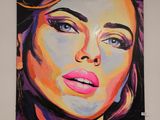 un tableau représentant une femme, accroché au mur