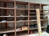 many shelves that have boxes and boxes on them in a room