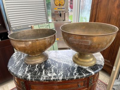 two bowls sitting on top of a table in a room
