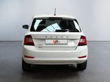 a white car that is parked in a room