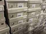 several stacks of boxes are stacked on top of each other in a store