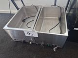 two stainless steel sinks with a price tag on them