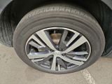 a close up of a car ' s tire on the street