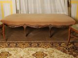 three chairs and a table in the corner of a room