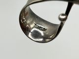 a silver spoon with a handle that has a word on it