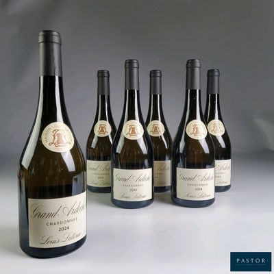 six bottles of wine sitting next to each other on a table