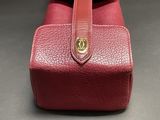 an image of a red purse on a table