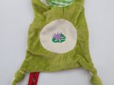 green frog sleeping on its back with a tag attached to it ' s back