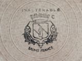 a picture of a plate with a coat of arms and a crown on it