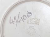 a white plate with a writing on it that says wwoe