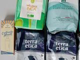 several bags of coffee are sitting on a table next to each other