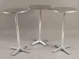 pair of chromed steel pedestals with a square table top