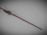 an old, rusty stick with a metal handle on a gray background