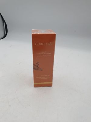 an orange box with a black handle sitting on a white surface