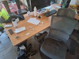 a desk with a chair and a computer on it