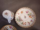 two plates and a bowl on a table