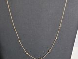 gold filled chain necklace on display in a jewelry store