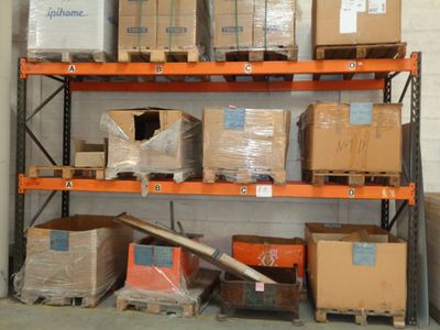 many boxes and boxes on the shelves in the warehouse