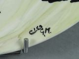 a close up of a surfboard with a black and white design