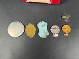 several pieces of metal are arranged in a row on a table