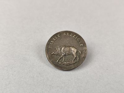 une petite pièce d'argent sur laquelle est représenté un taureau