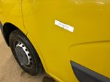 a close up of a yellow truck with a sticker on it