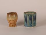 two cups sitting next to each other on a table