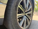 a close up of a car tire on the road