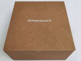 an open box with a logo on it sitting on a white surface