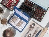 a table with silverware and silverware on it