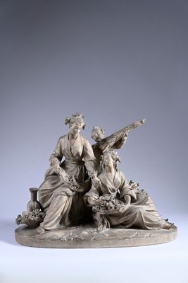 an image of a statue of a group of people sitting on top of a table