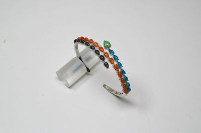 a close up of a ring on a white surface