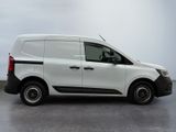the white van is parked on the concrete floor in the room