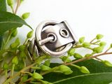 a close up of a ring with a face on it