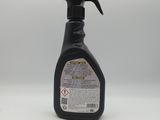 a spray bottle of cleaner on a white surface