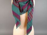 a close up of a mannequin head with a scarf on it