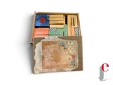 a small box with a lot of small tiles inside of it
