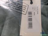 a label on the back of a jacket with a barcode on it