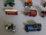 a lot of toy vehicles that are on a table