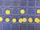 a game board with yellow dots on it on the floor