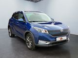 the blue suv is parked in a large room with a black floor