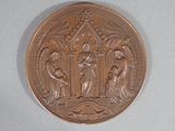 an image of a bronze medal with the image of jesus and mary