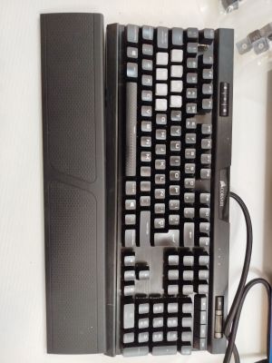 a computer keyboard and mouse sitting on a desk
