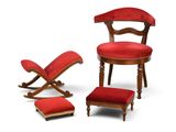 a red chair and ottoman in front of a white background