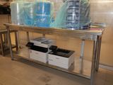 three containers of water sitting on a table in the kitchen