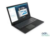 a laptop computer that is sitting on a white surface
