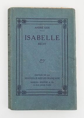 an old book with a blue cover sitting on top of a white table