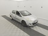 a picture of a small white car in a garage