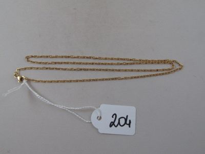 a gold chain that has a tag on it
