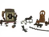 many different types of figurines displayed on a white surface